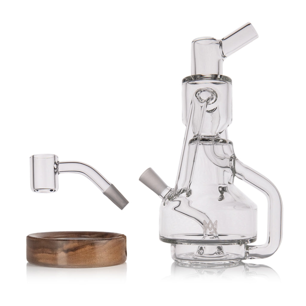 MJ Arsenal Apex Mini Dab Rig disassembled, showing banger, carb cap, and walnut base