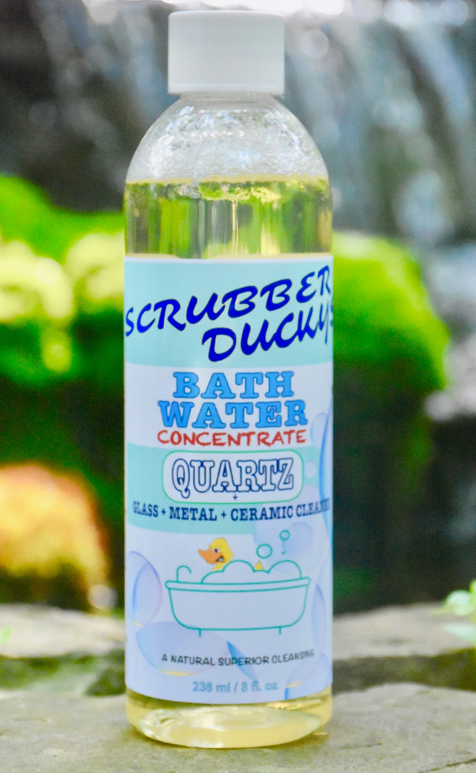 Clean with the power of nature using our All NEW formula. Scrubber Duckys BATH WATER Concentrate naturally removes tough built-up stains on any glass or quartz surface! Use alone in place of harsh chemical cleaners