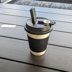 Puffco Cupsy Coffee Cup Bong with lid on