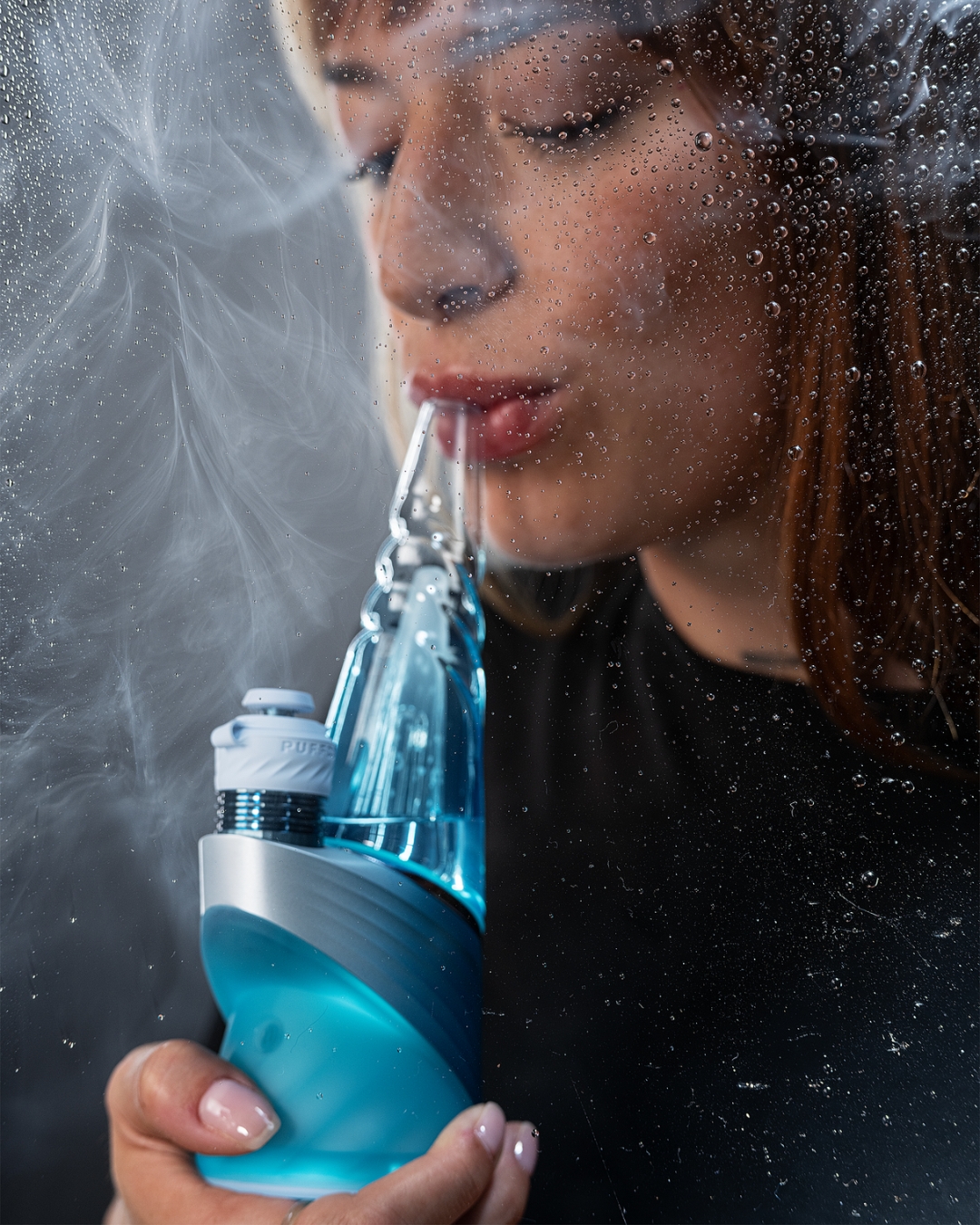 Puffco Peak Pro Glacier with vapor cloud